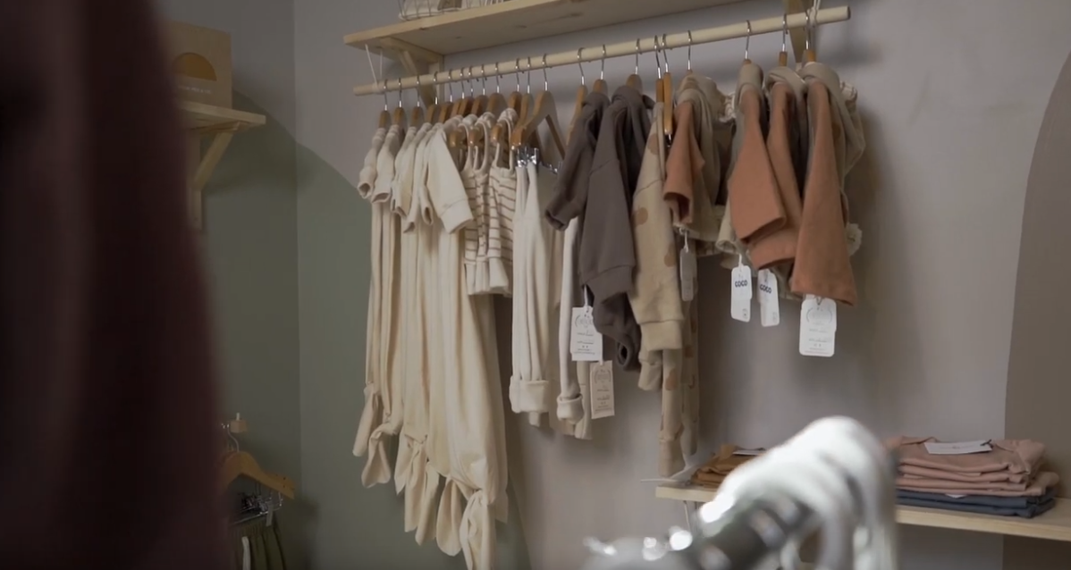 Clothing hanging in a clothing store.